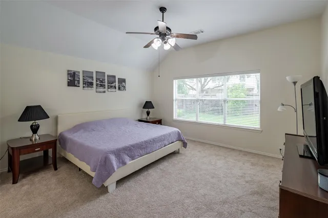 a bed room with a bed and a window