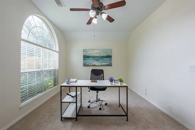 a workspace with furniture and a window