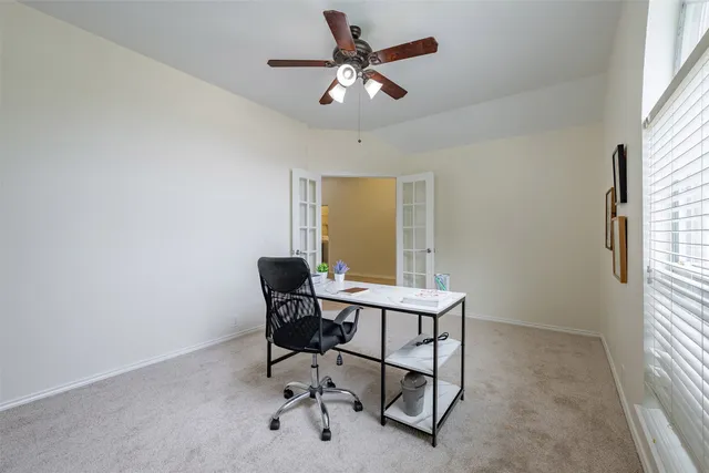 a workspace with furniture and a window