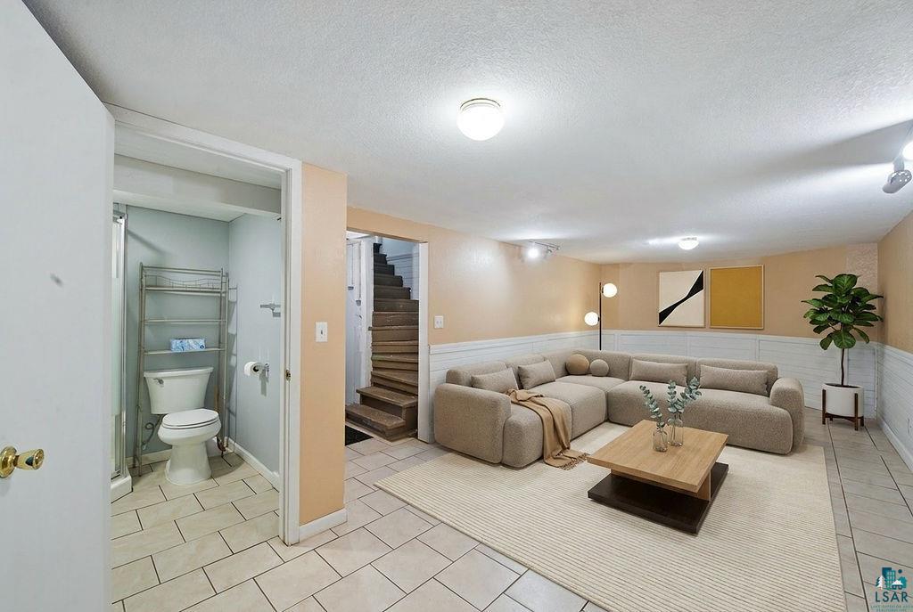 122 3rd Street Cloquet, MN 55720 - Photo 31 of 42 Lower-level recreation room featuring a neutral color palette and recessed lighting