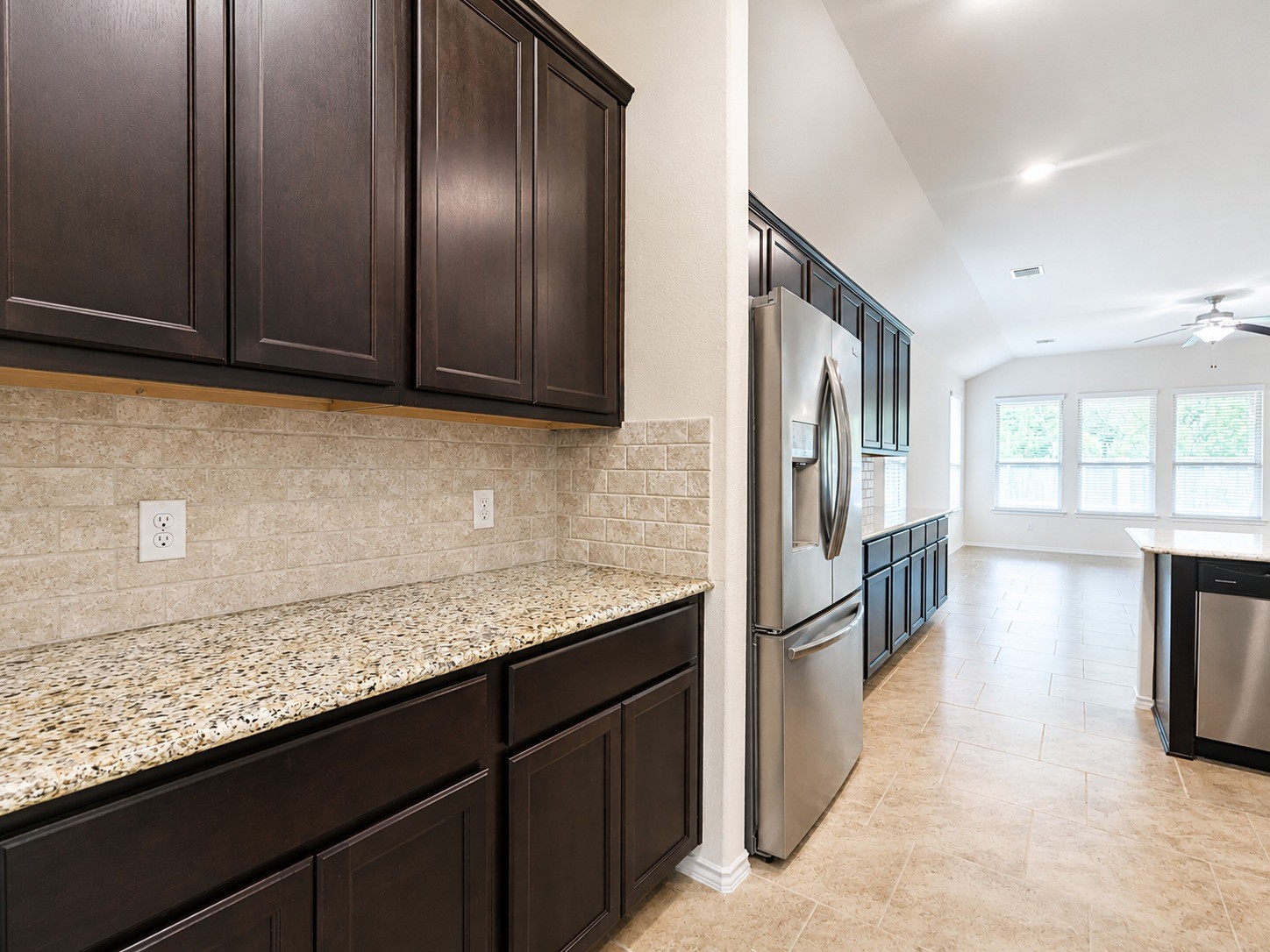 24315 Ravenna Landing Loop Spring, TX 77389 - Photo 15 of 37 a kitchen with granite countertop stainless steel appliances window and refrigerator