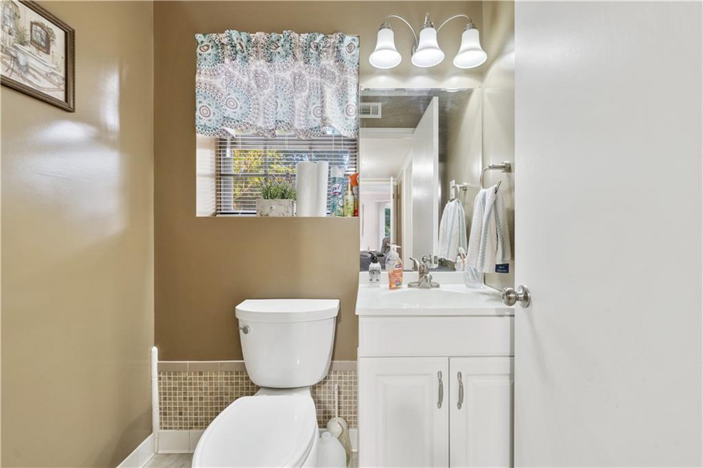 6633 Cameron Road Morrow, GA 30260 - Photo 12 of 41 a bathroom with a sink mirror and toilet