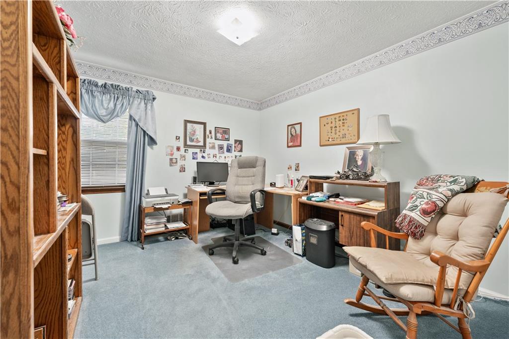 6633 Cameron Road Morrow, GA 30260 - Photo 19 of 41 a living room with furniture a couch and a bookshelf