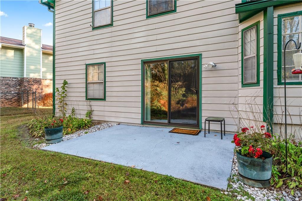 6633 Cameron Road Morrow, GA 30260 - Photo 23 of 41 a front view of a house with a garden