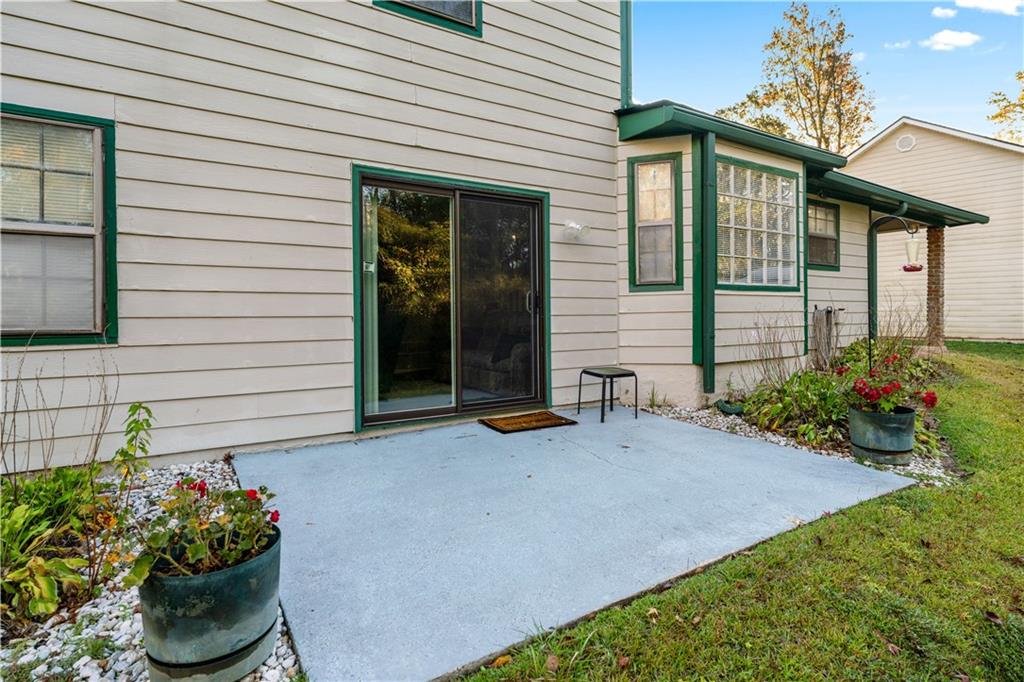 6633 Cameron Road Morrow, GA 30260 - Photo 24 of 41 a wooden bench sitting in front of a house