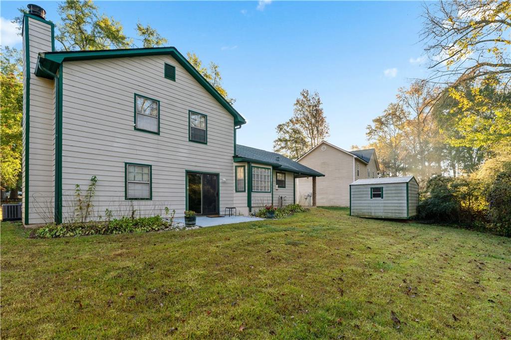 6633 Cameron Road Morrow, GA 30260 - Photo 29 of 41 a view of a house with a yard