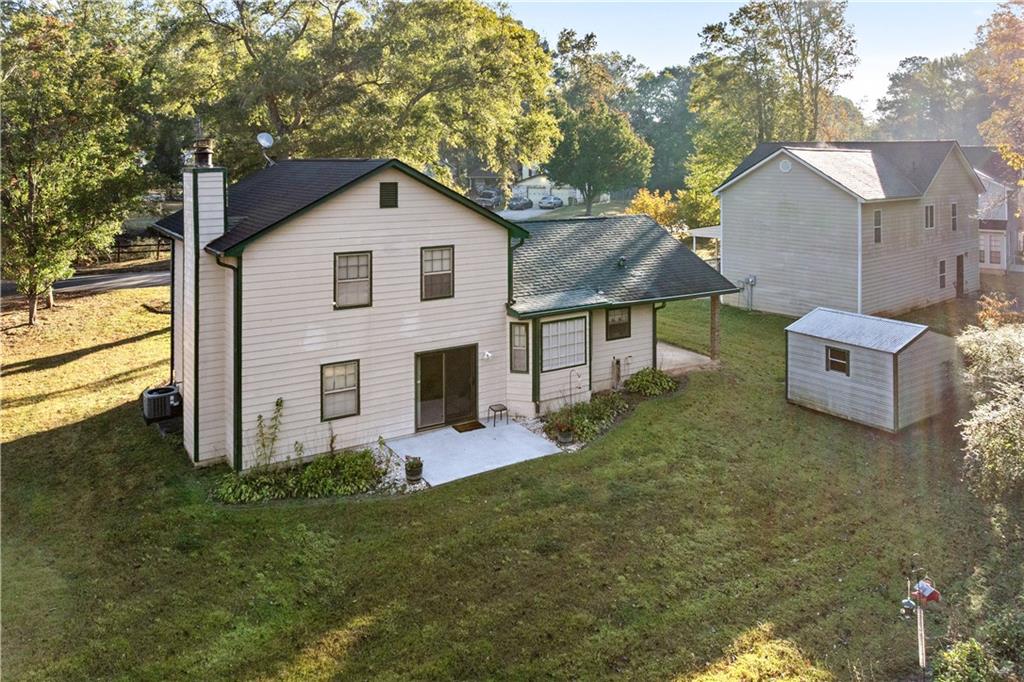 6633 Cameron Road Morrow, GA 30260 - Photo 32 of 41 a front view of house with yard and trees in the background