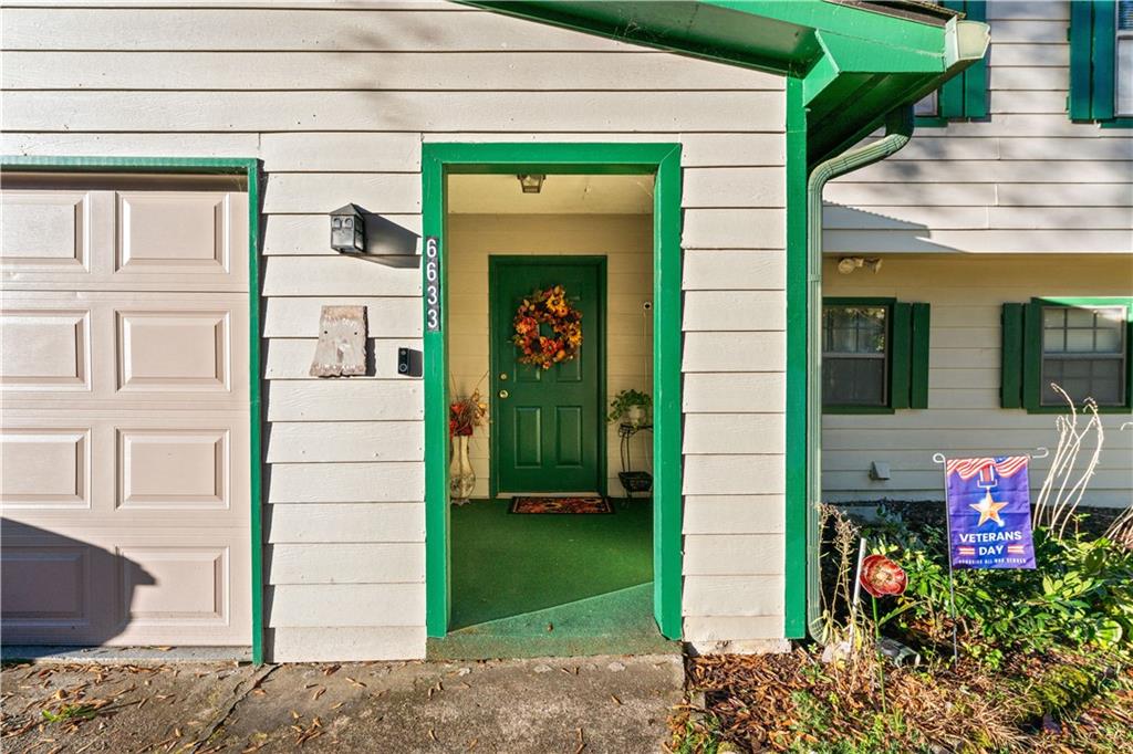 6633 Cameron Road Morrow, GA 30260 - Photo 33 of 41 a front view of a house with a garden