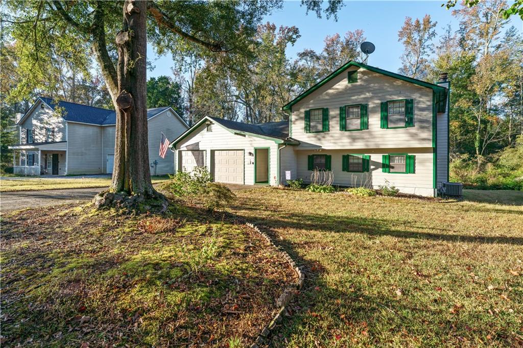 6633 Cameron Road Morrow, GA 30260 - Photo 36 of 41 a front view of a house with a yard