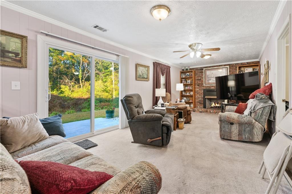 6633 Cameron Road Morrow, GA 30260 - Photo 4 of 41 a living room with furniture and a flat screen tv