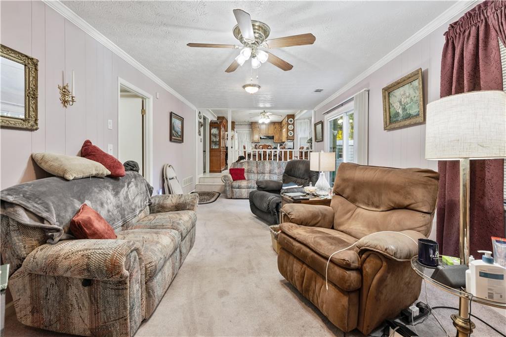 6633 Cameron Road Morrow, GA 30260 - Photo 5 of 41 a living room with furniture and a ceiling fan
