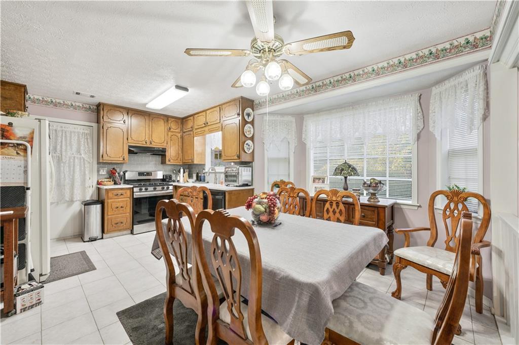 6633 Cameron Road Morrow, GA 30260 - Photo 6 of 41 a view of a dining room with furniture window and outside view