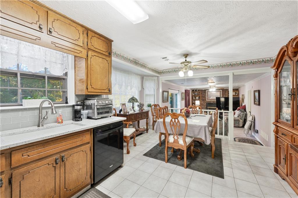 6633 Cameron Road Morrow, GA 30260 - Photo 8 of 41 a kitchen with lots of counter top space and dining table