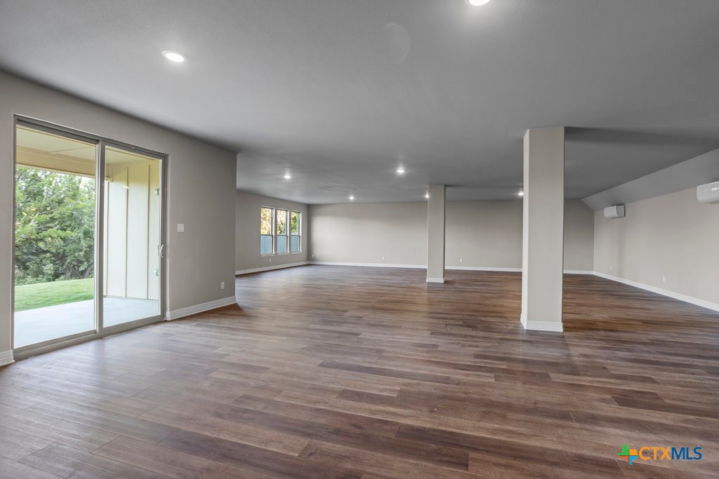 2136 Oak Draw Court Belton, TX 76513 - Photo 37 of 46 an empty room with wooden floor and windows