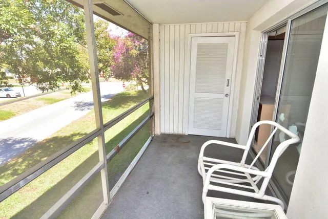a view of two chairs in balcony