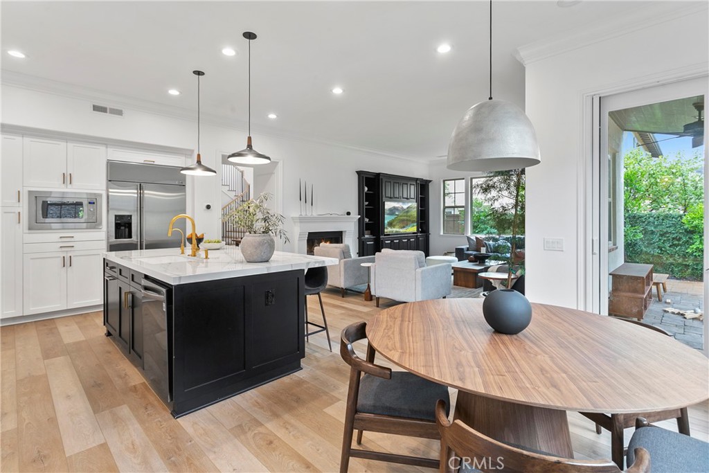 3 Adele Street Ladera Ranch, CA 92694 - Photo 16 of 34 a kitchen with a stove cabinets and wooden floor