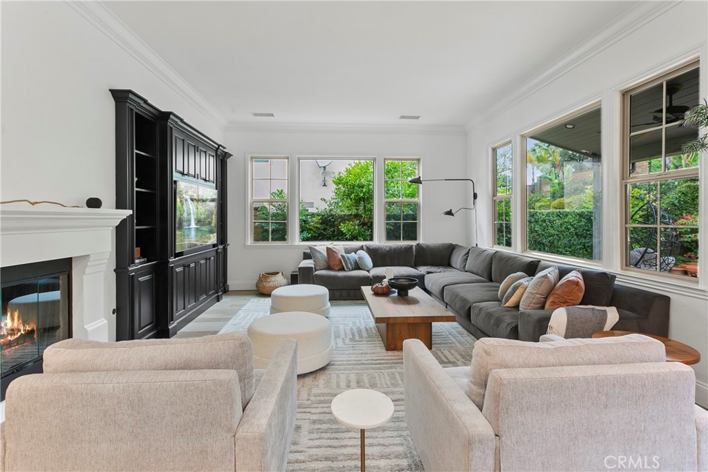 3 Adele Street Ladera Ranch, CA 92694 - Photo 18 of 34 a living room with furniture fireplace and large windows