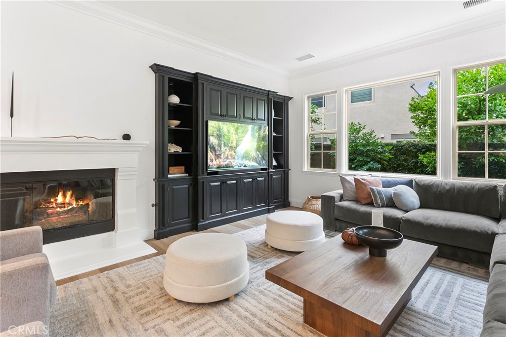3 Adele Street Ladera Ranch, CA 92694 - Photo 20 of 34 a living room with furniture and a fireplace