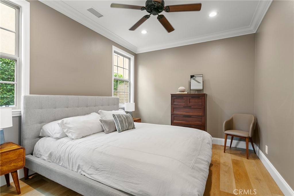 3 Adele Street Ladera Ranch, CA 92694 - Photo 24 of 34 a bedroom with a bed a dresser and a window