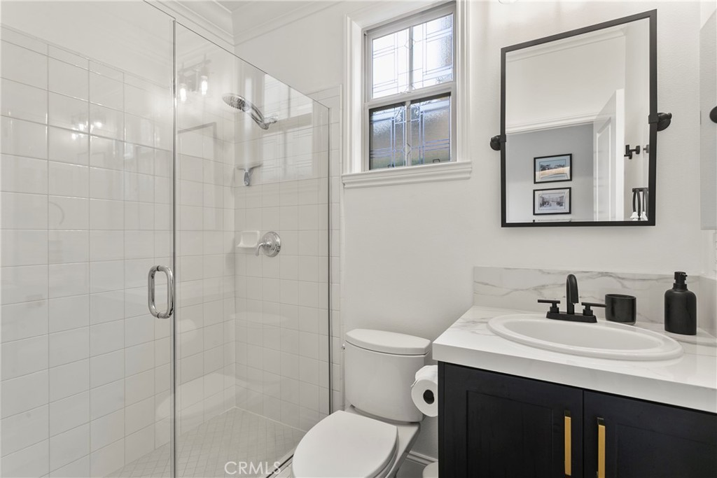 3 Adele Street Ladera Ranch, CA 92694 - Photo 30 of 34 a bathroom with a sink toilet and shower