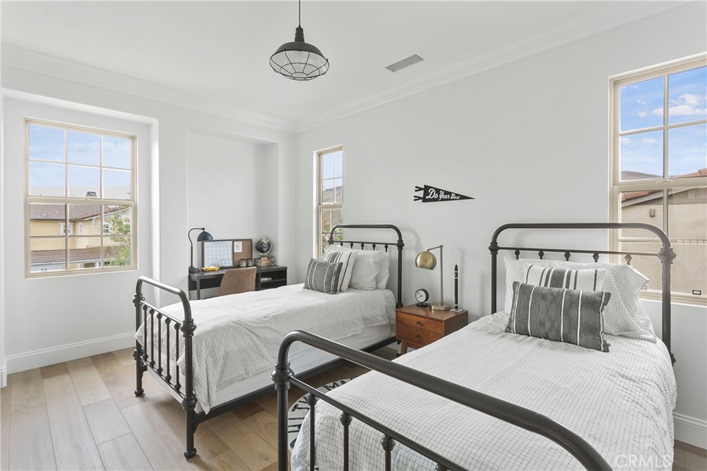 3 Adele Street Ladera Ranch, CA 92694 - Photo 32 of 34 a bedroom with two beds and wooden floor