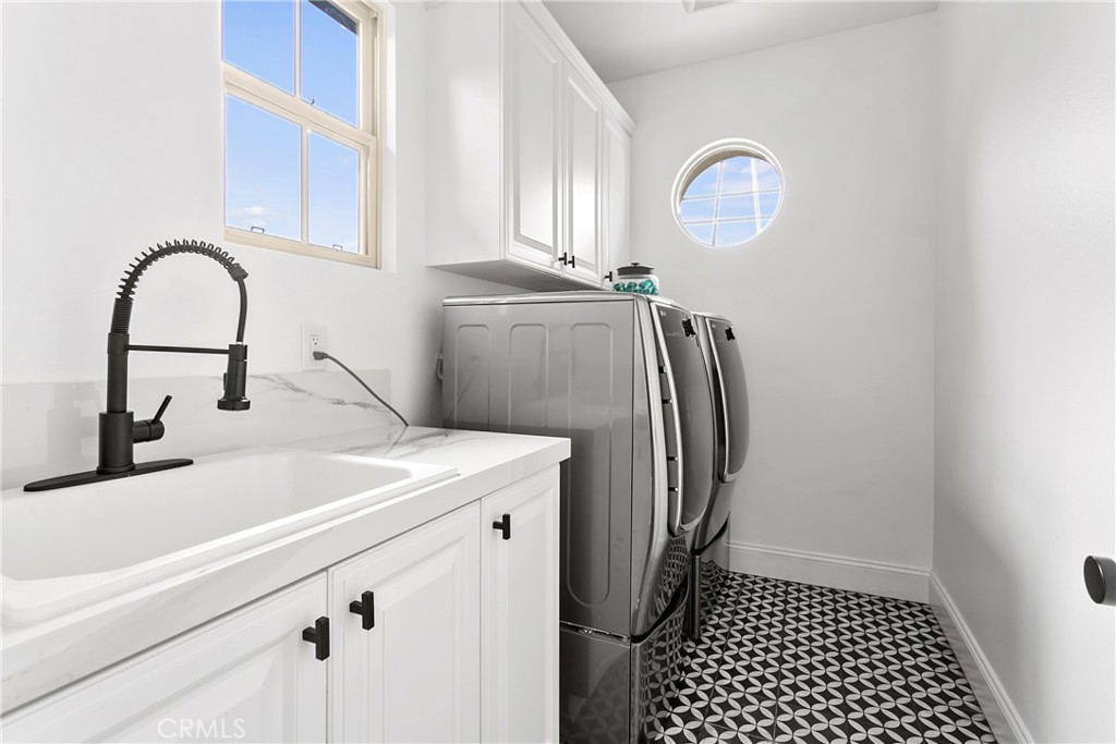 3 Adele Street Ladera Ranch, CA 92694 - Photo 34 of 34 a close view of a sink a faucet and a refrigerator in a kitchen