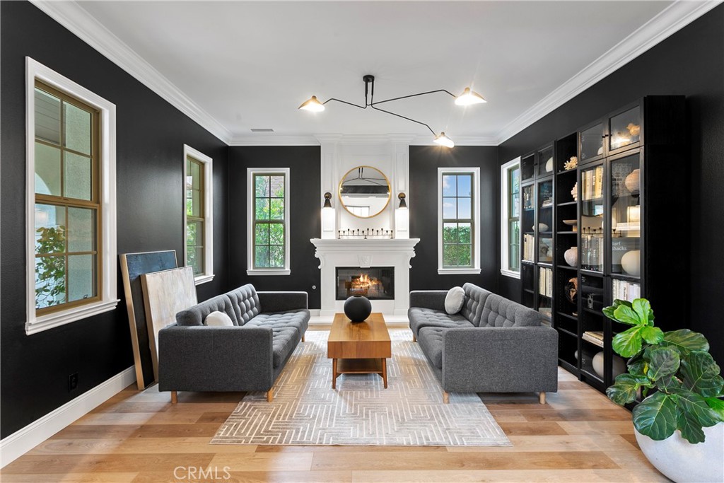 3 Adele Street Ladera Ranch, CA 92694 - Photo 4 of 34 a living room with furniture fireplace and a large window