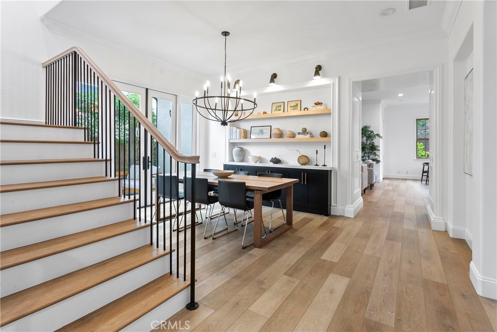 3 Adele Street Ladera Ranch, CA 92694 - Photo 6 of 34 a view of a hallway with wooden floor and staircase
