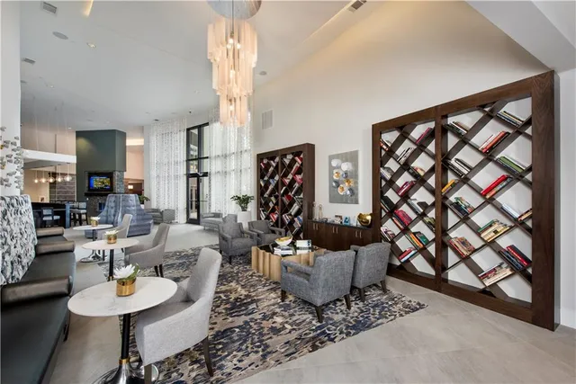 a living room with furniture and a painting