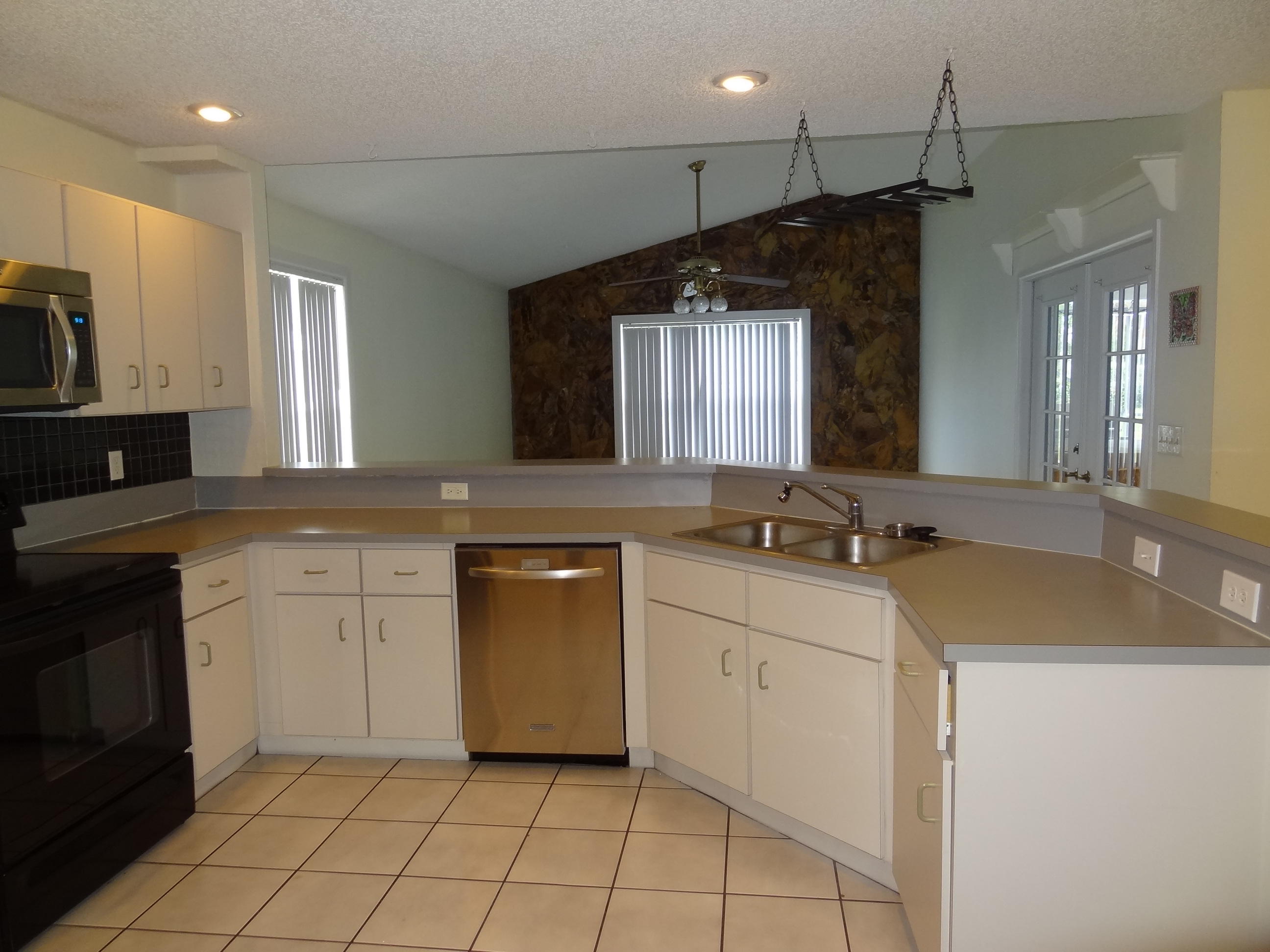22099 Flower Drive Boca Raton, FL 33428 - Photo 13 of 25 LARGE OPEN KITCHEN TO FAMILY ROOM
