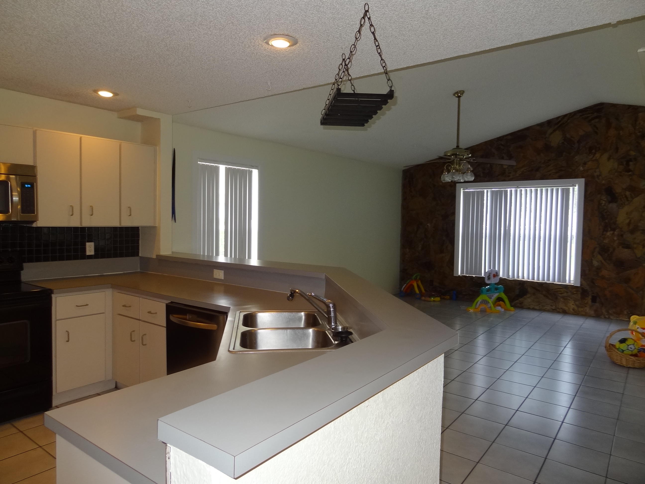 22099 Flower Drive Boca Raton, FL 33428 - Photo 14 of 25 LARGE OPEN KITCHEN TO FAMILY ROOM