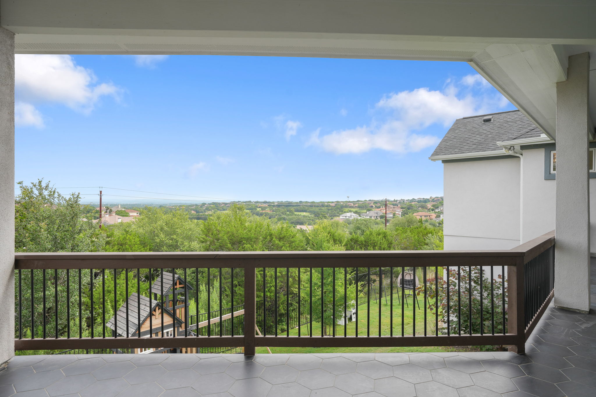 104 Lodestone Cove Austin, TX 78738 - Photo 22 of 40 Enjoy expansive, rolling hill views from this tranquil outdoor living space.