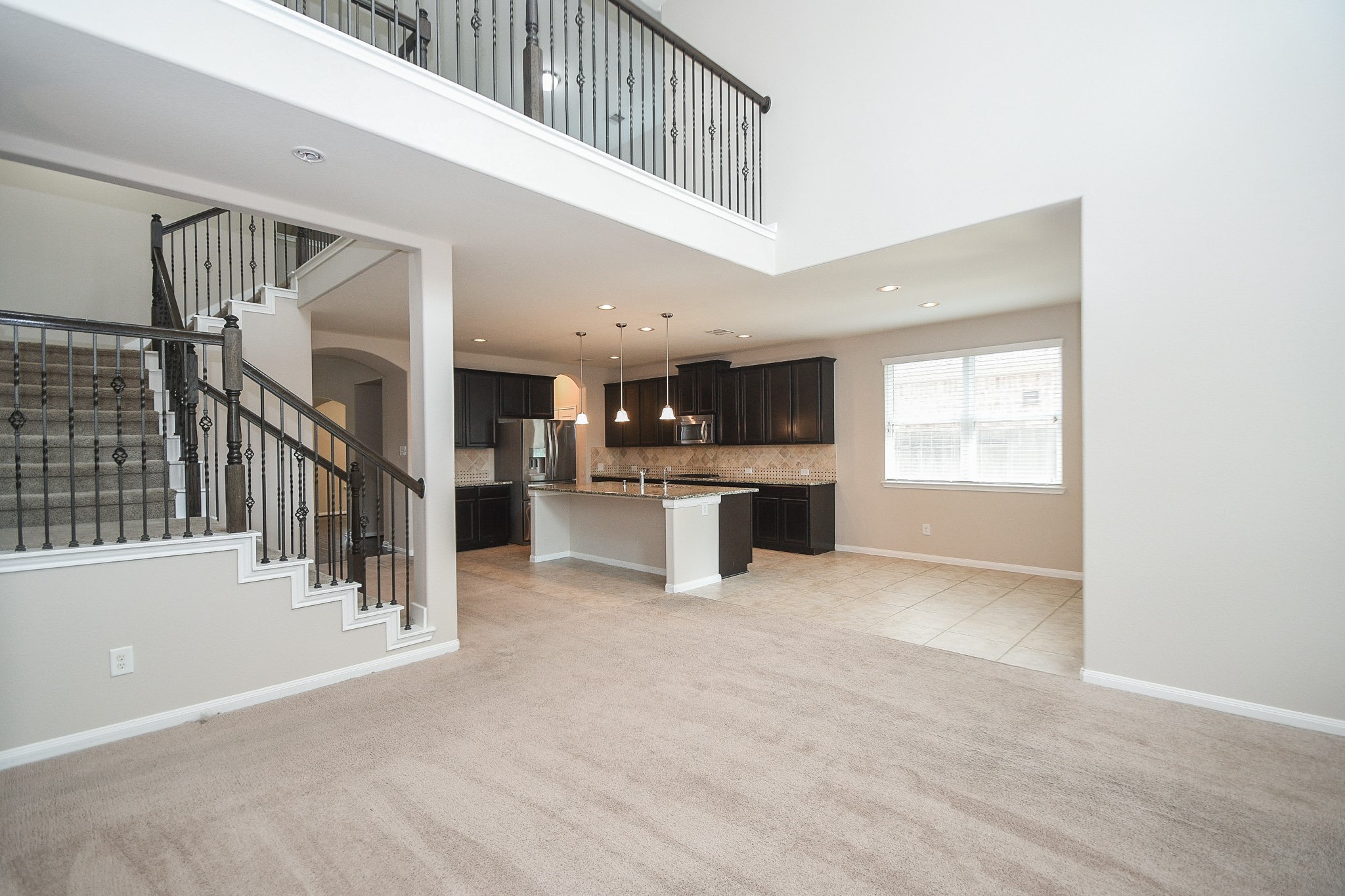 22139 Rustling Springs Drive Spring, TX 77389 - Photo 4 of 23 a view of a kitchen with a sink and cabinets
