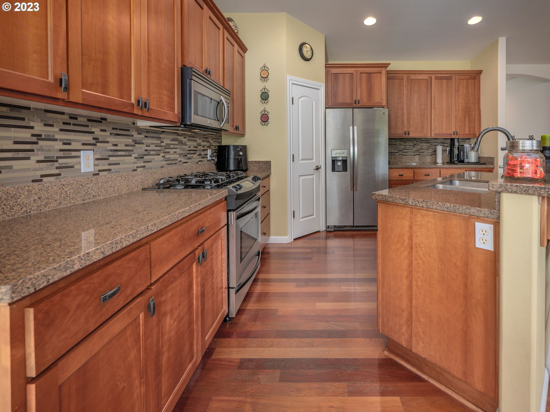 56470 Hazen Road Warren, OR 97053 - Photo 14 of 39 a kitchen with stainless steel appliances granite countertop a refrigerator and a stove