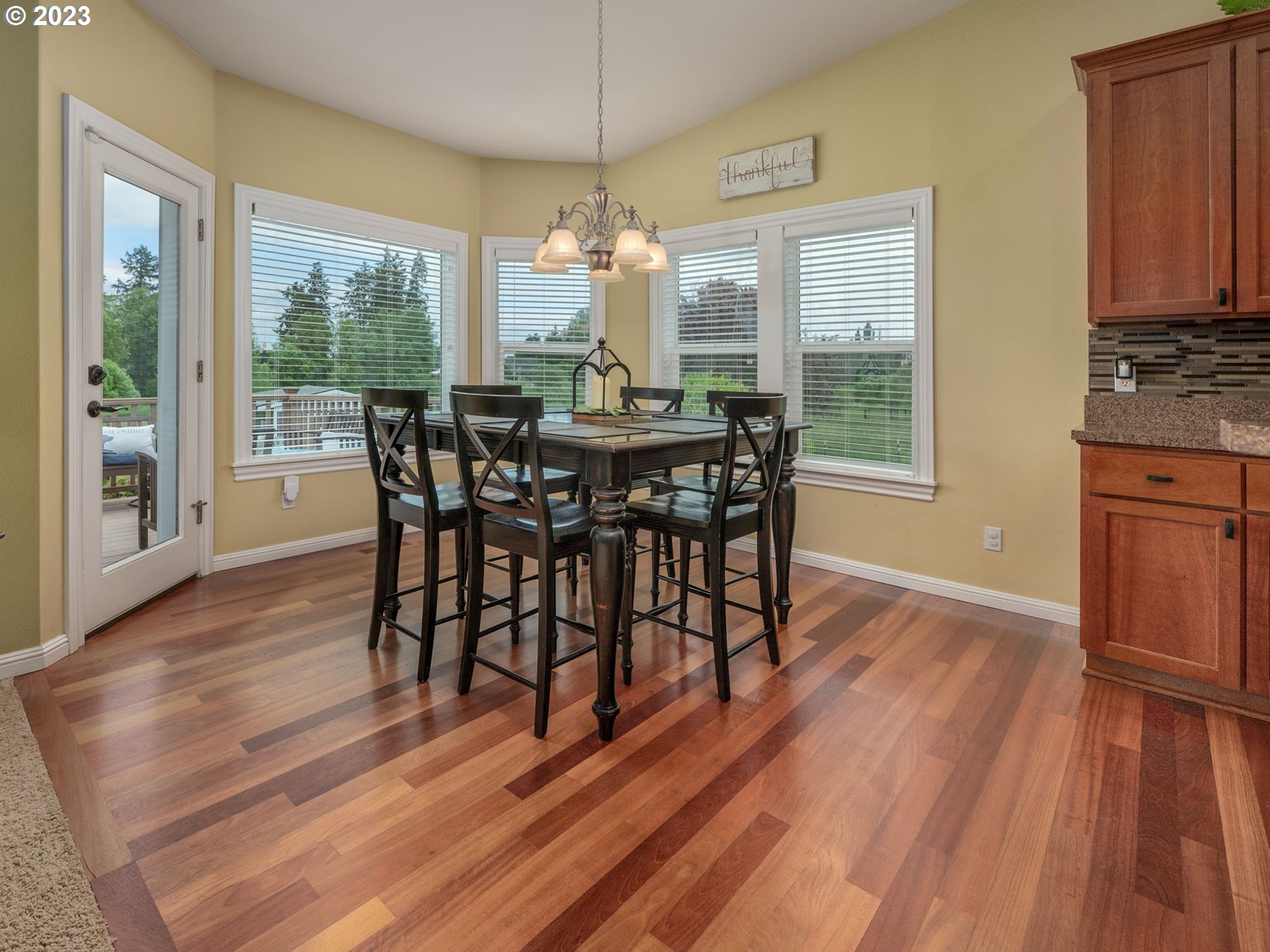 56470 Hazen Road Warren, OR 97053 - Photo 15 of 39 a view of a dining room with furniture window and wooden floor