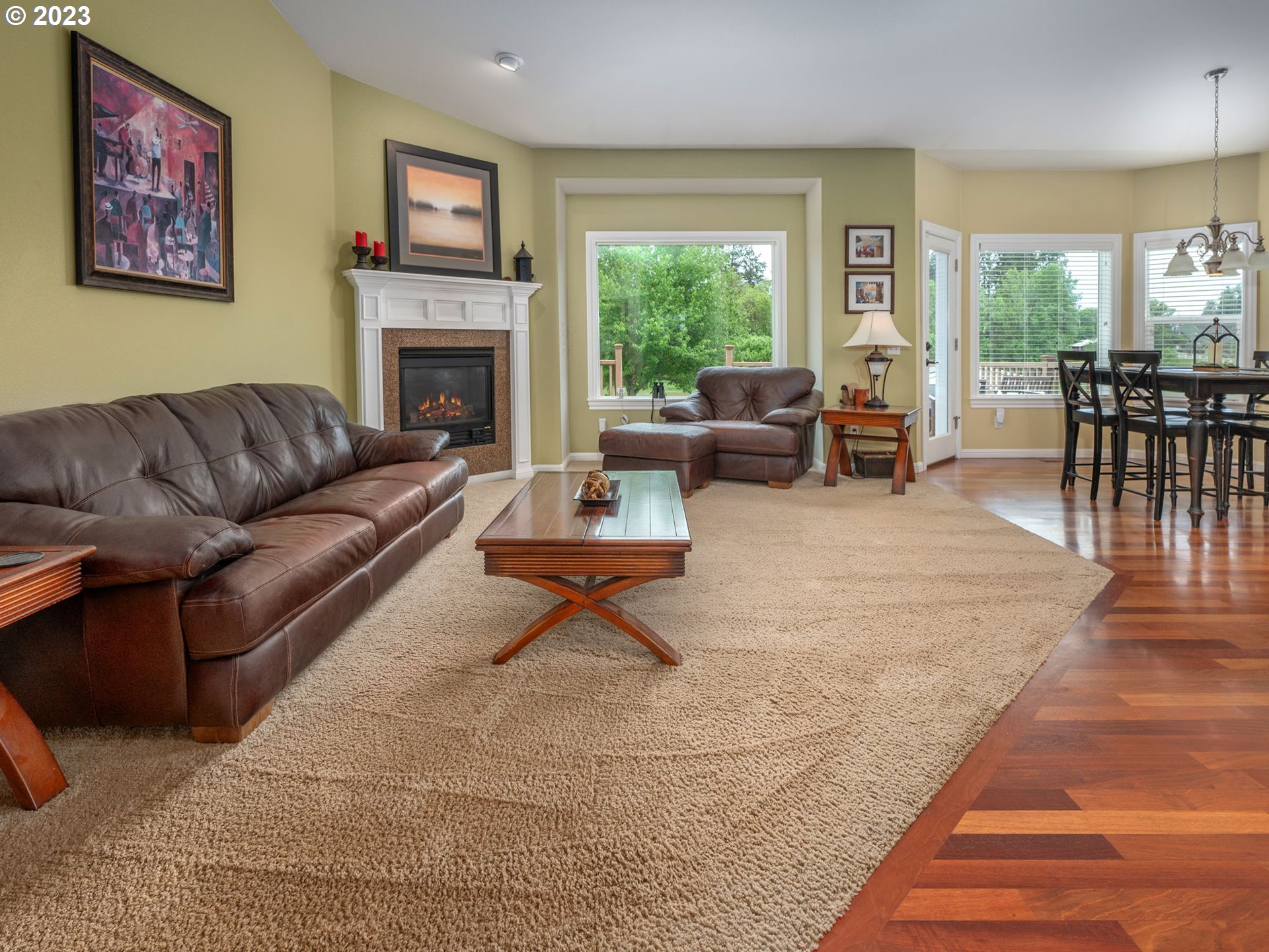 56470 Hazen Road Warren, OR 97053 - Photo 17 of 39 a living room with furniture fireplace and a table