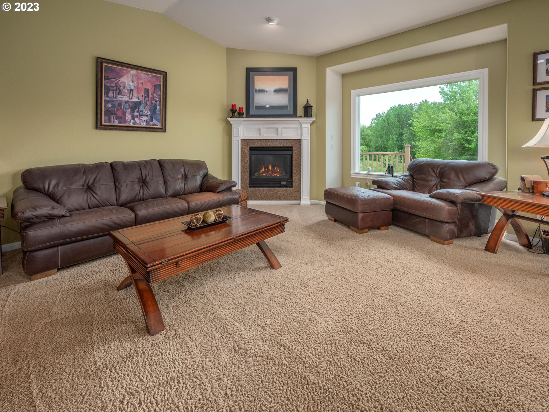 56470 Hazen Road Warren, OR 97053 - Photo 18 of 39 a living room with furniture and a fireplace