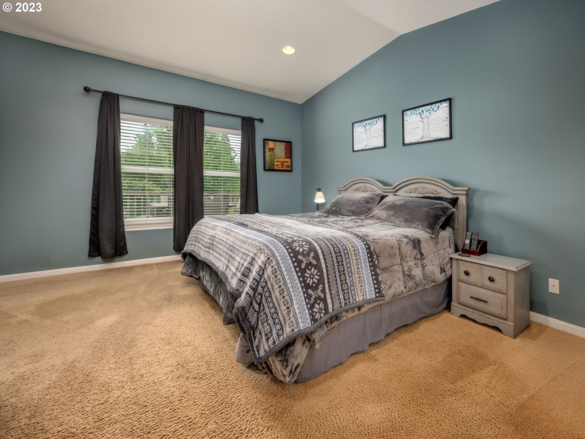 56470 Hazen Road Warren, OR 97053 - Photo 20 of 39 a bedroom with a bed and glass window