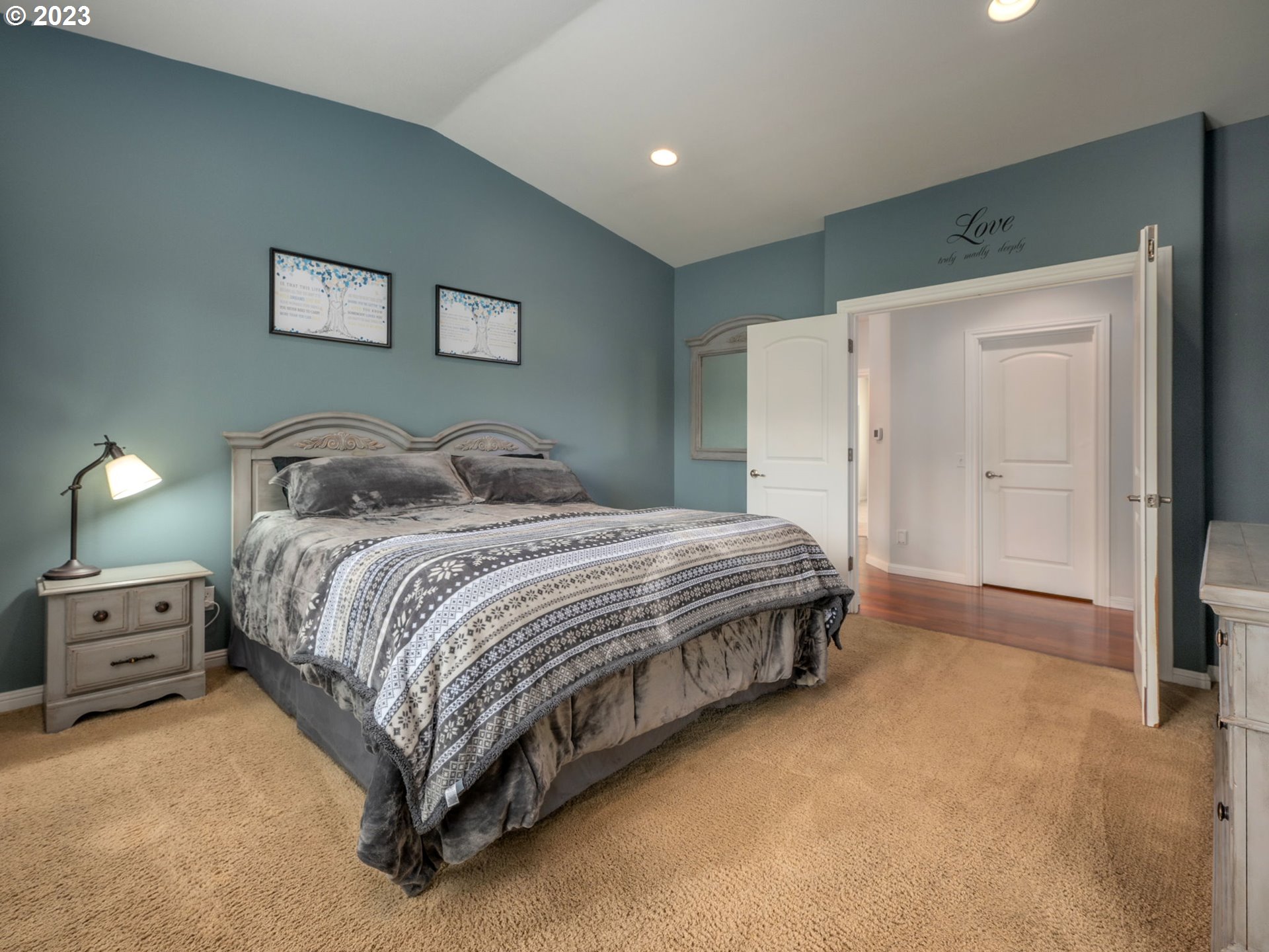 56470 Hazen Road Warren, OR 97053 - Photo 21 of 39 a bedroom with a bed and a lamp