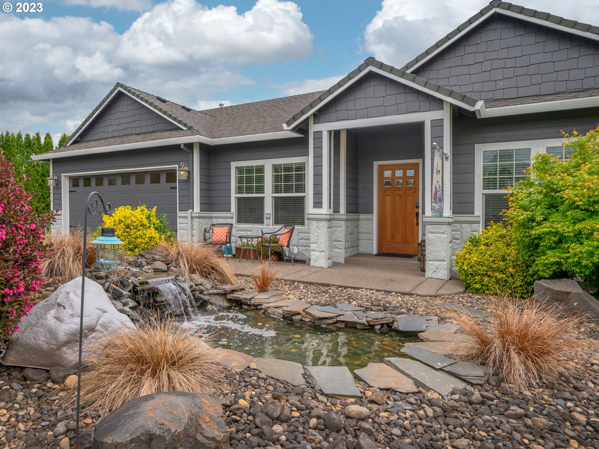 56470 Hazen Road Warren, OR 97053 - Photo 4 of 39 a front view of house with outdoor seating