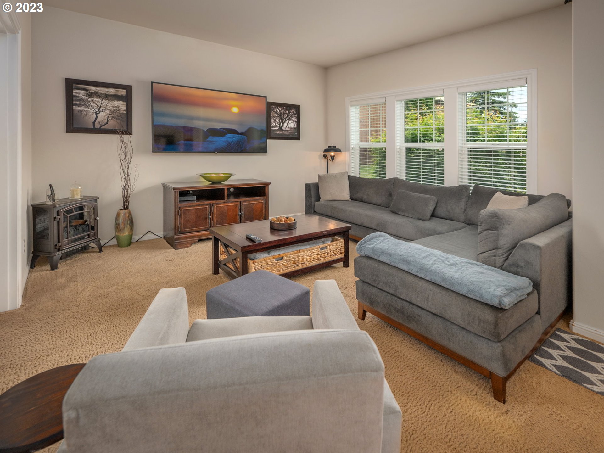 56470 Hazen Road Warren, OR 97053 - Photo 6 of 39 a living room with furniture and a flat screen tv