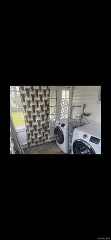 a view of a floor to ceiling window and a kitchen view