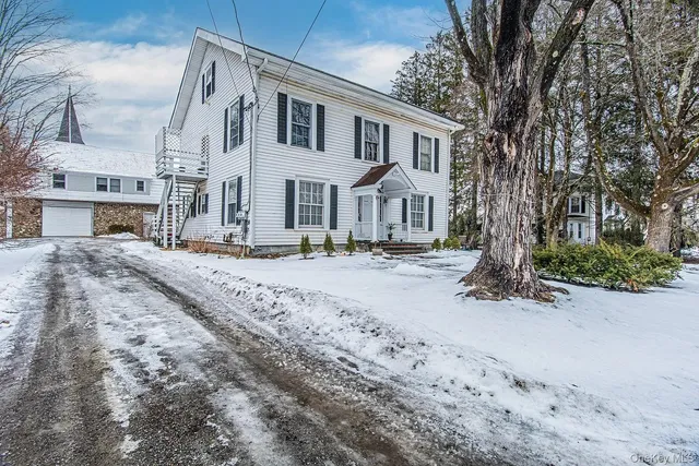 a front view of a building with a road