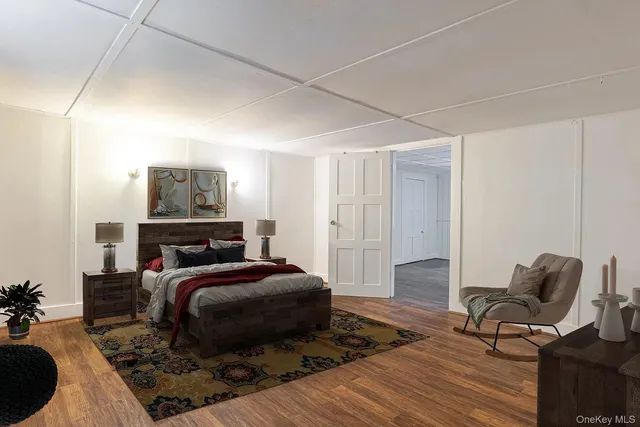 a bedroom with a bed and a chair