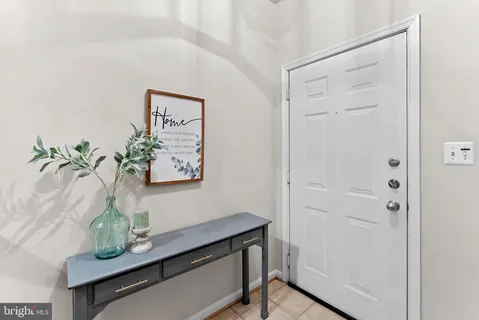 a view of room with window and wooden floor