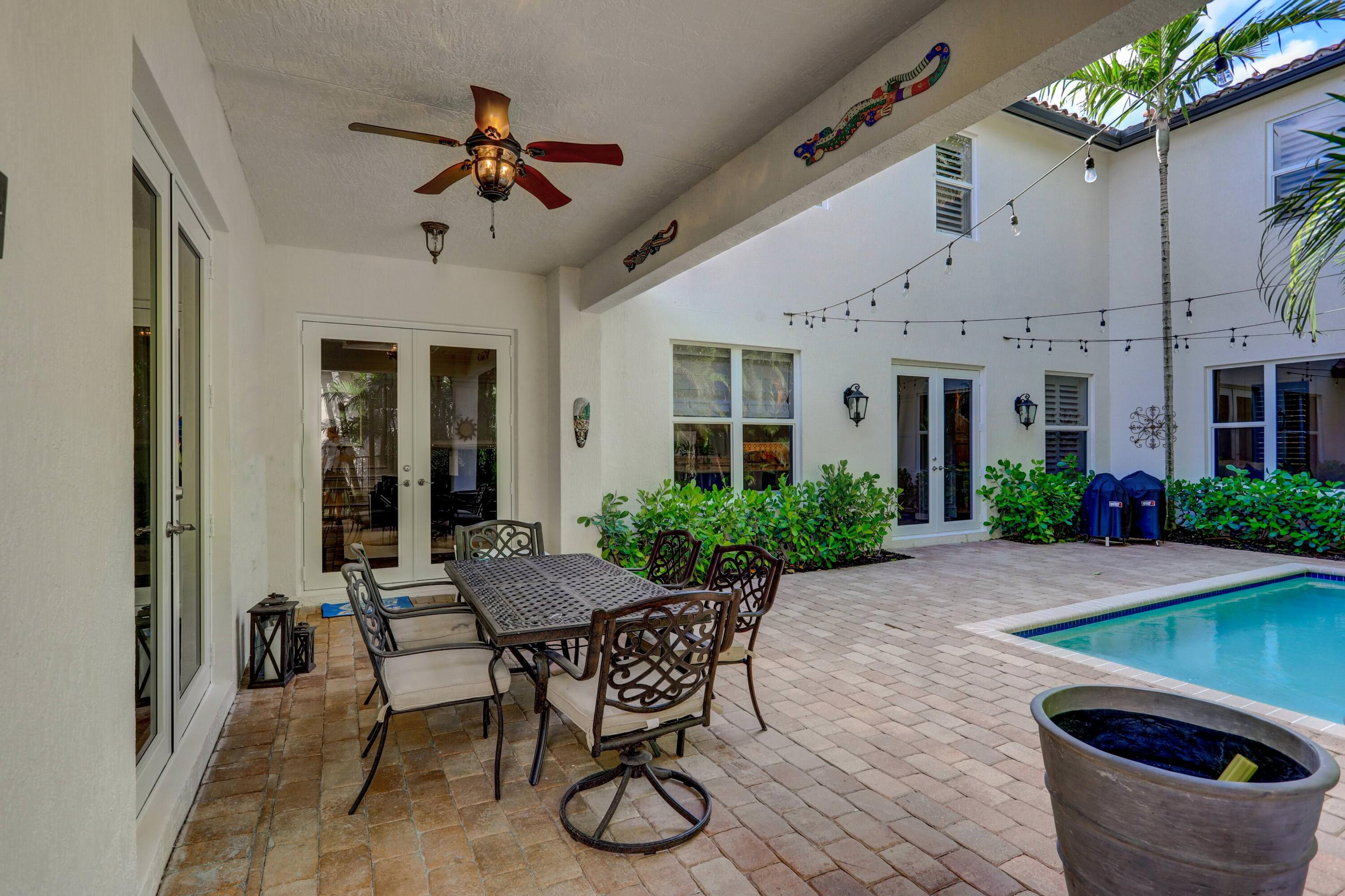 107 Barcelona Drive Jupiter, FL 33458 - Photo 56 of 73 Back Covered Porch