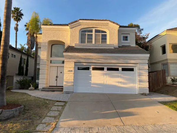 a front view of a house with a garage