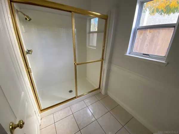 a view of entryway and hall with a front door