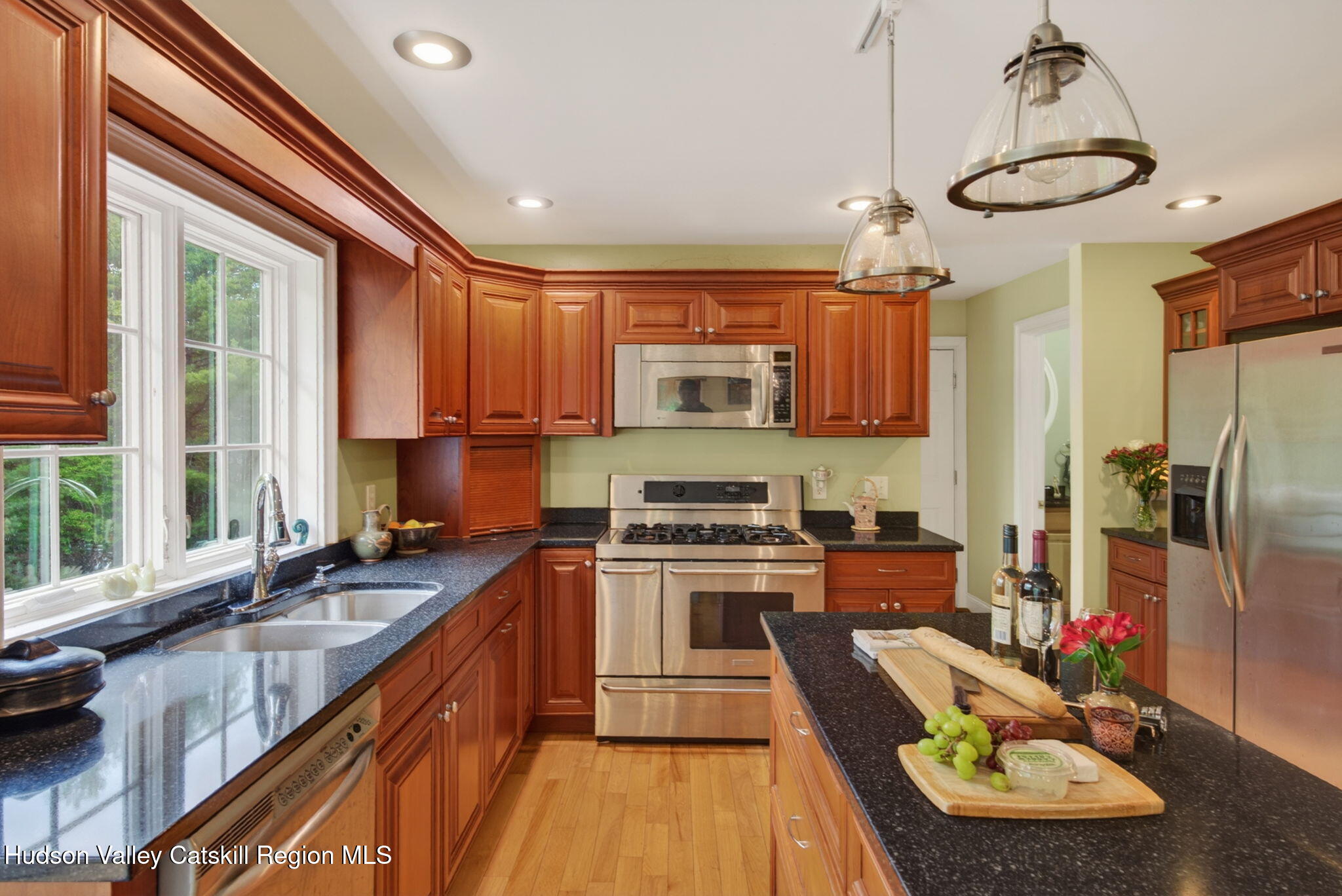 189 Bush Road Stone Ridge, NY 12484 - Photo 12 of 60 a kitchen with stainless steel appliances granite countertop a sink stove and refrigerator