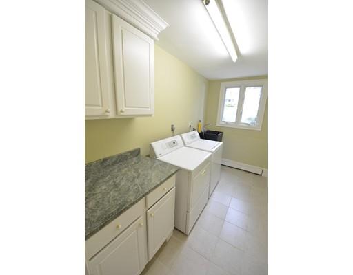 26 Mohawk Road Canton, MA 02021 - Photo 24 of 28 a bathroom with a sink and a mirror